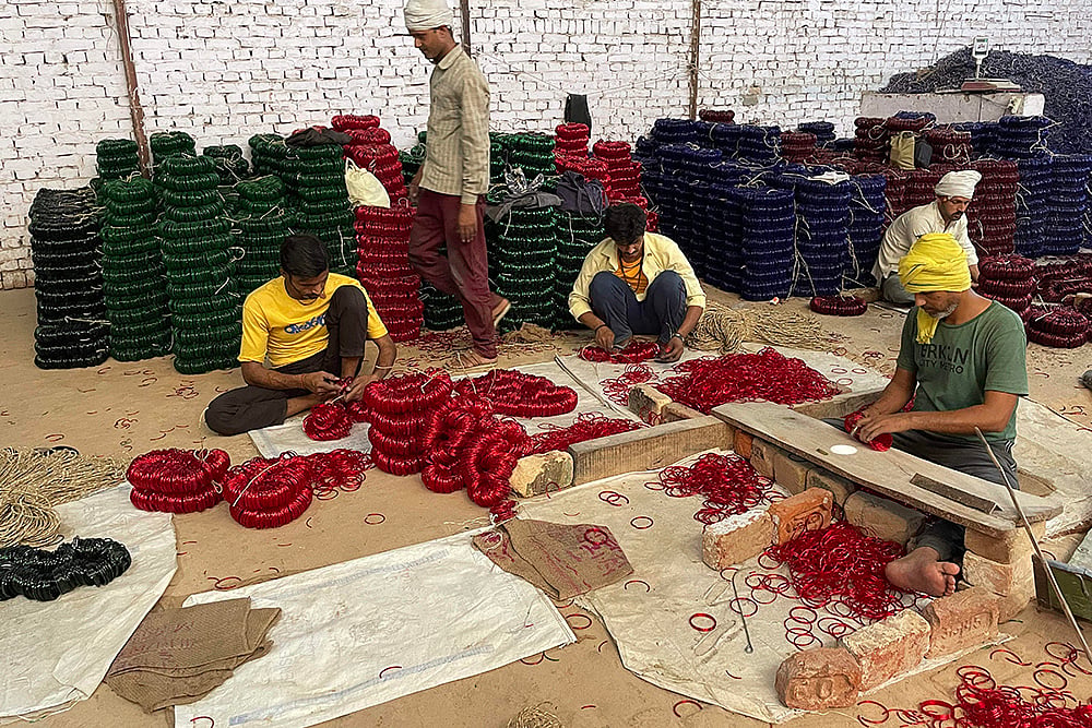 | Photo: PTI/Uzmi Athar : Bangle Industry in UP's Firozabad